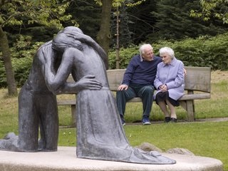 Thriving-Baby-Boomers - Relationships - Old Couple on bench - young couple in Love statue