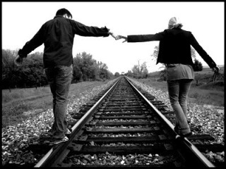 Thriving-Baby-Boomers - Companionship - Couple walking the railway tracks