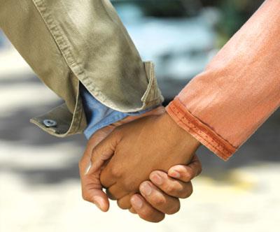 Thriving-Baby-Boomers - Cooperation - Male and Female holding hands 